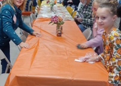 Young Girls Cleaning the Table