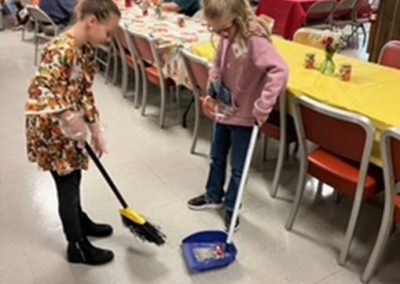 Young Girls Sweeping the Floor